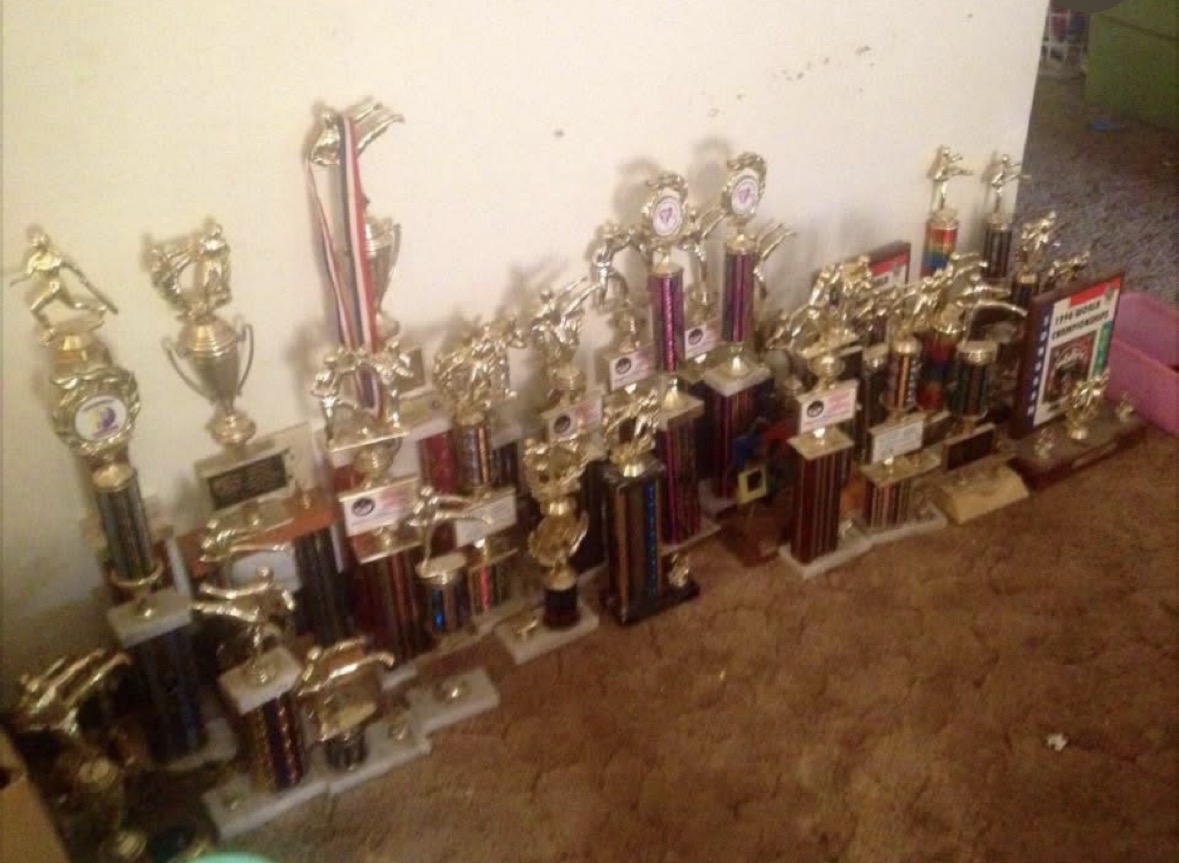 Michelle’s collection of martial arts trophies.
