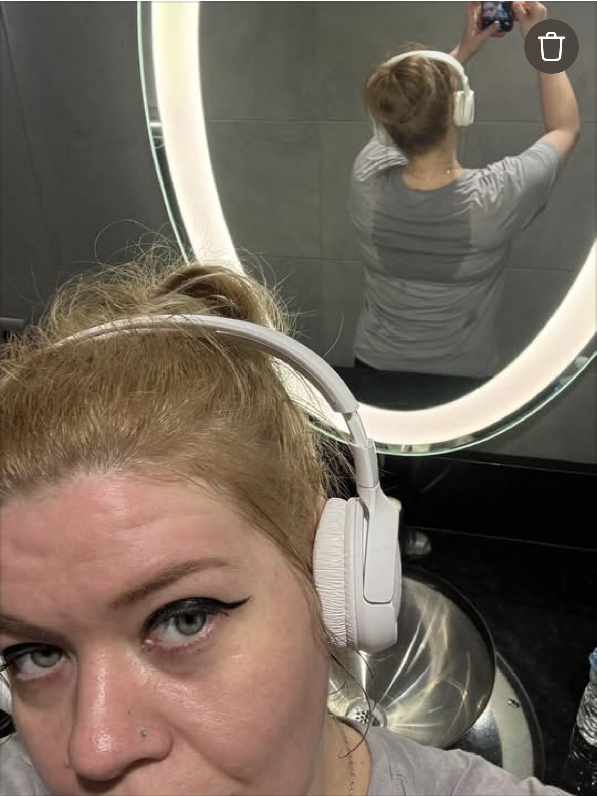Michelle wearing headphones during a gym session.